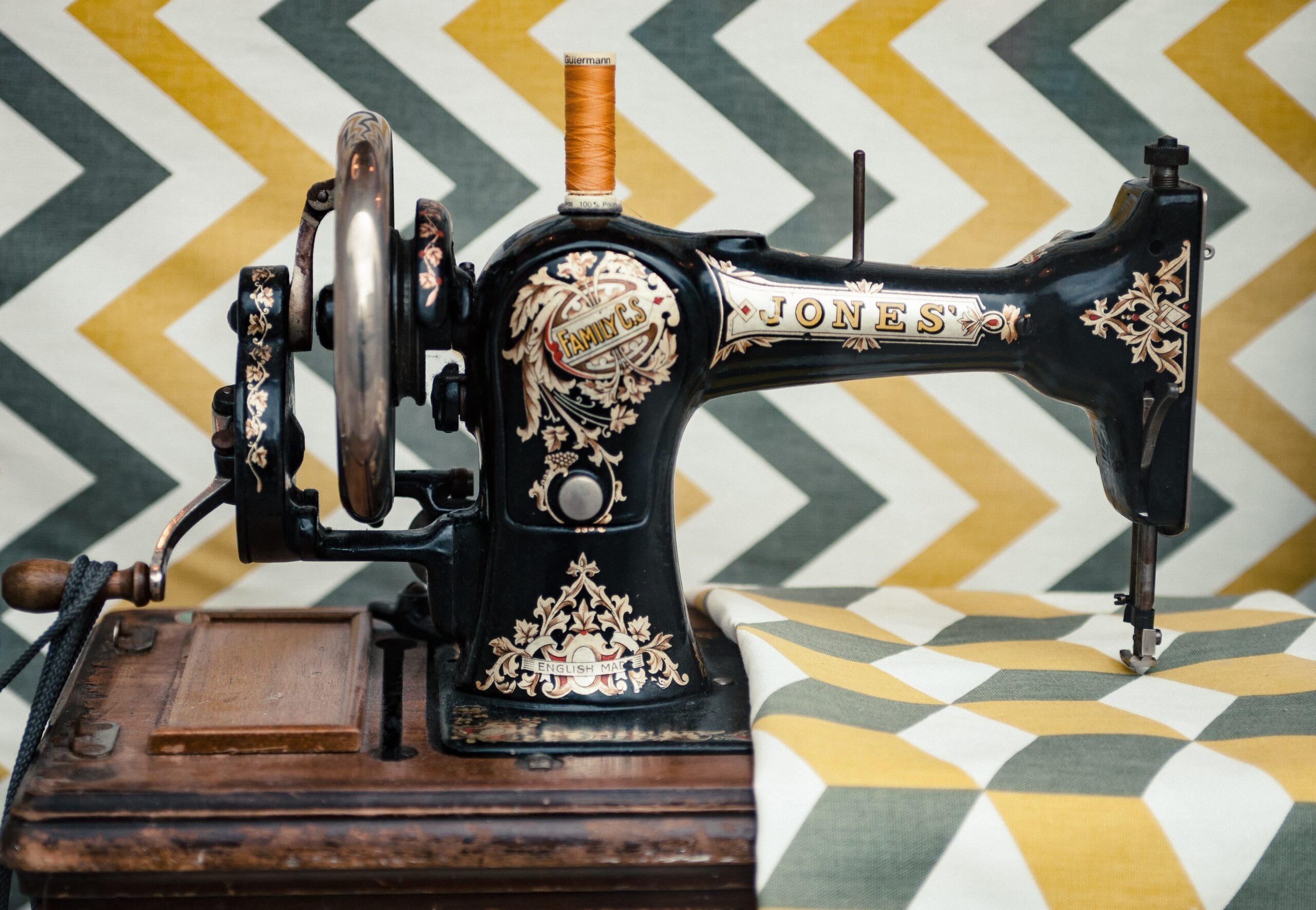 Sewing machine in front of a geometric print