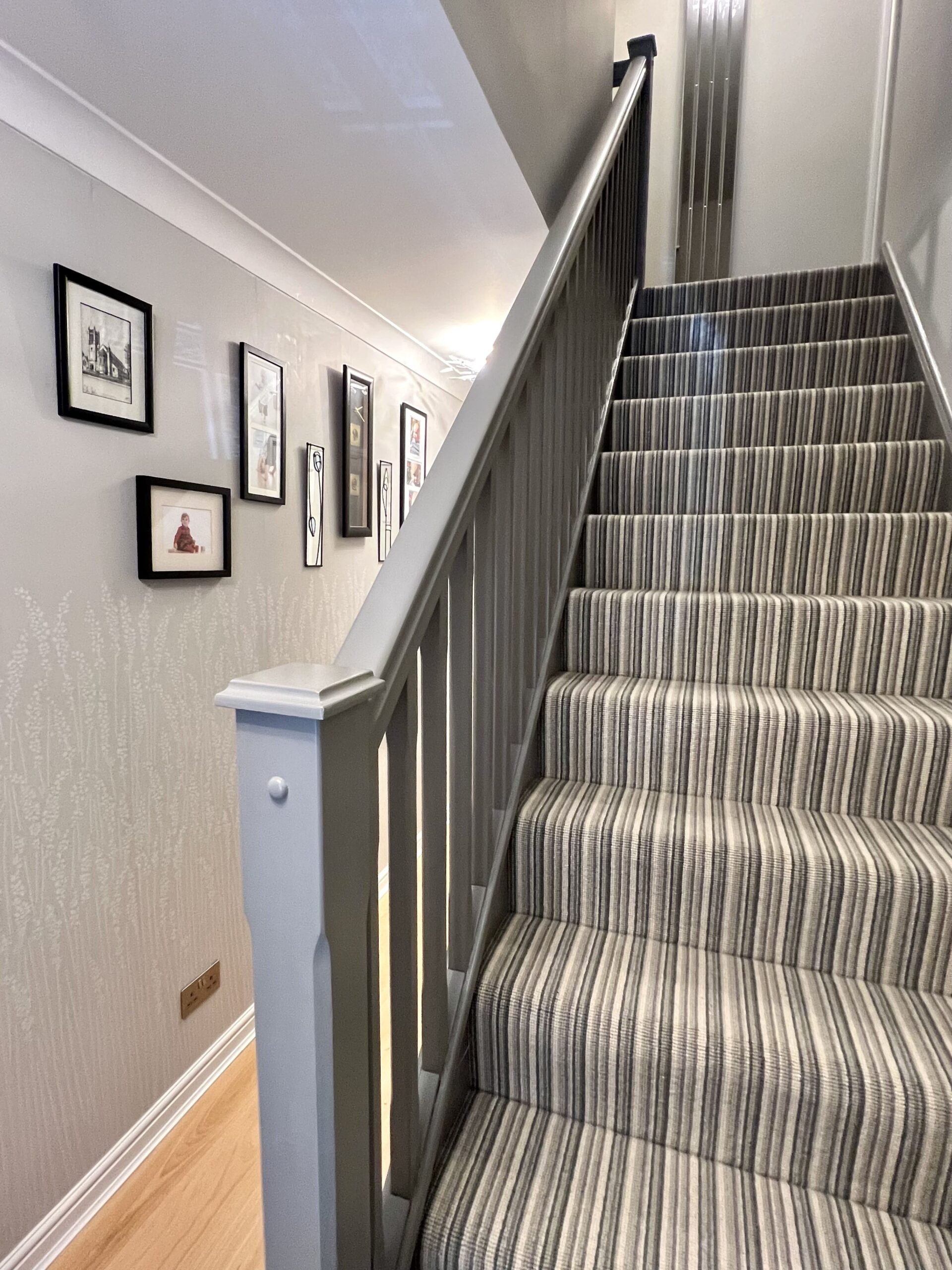 Stairwell and hallway with images on the wall